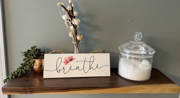 floating shelf with breathe sign bath salts and essential oil diffuser